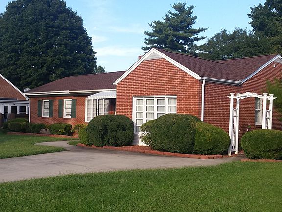 Well maintained brick ranch with beautiful landscaping.