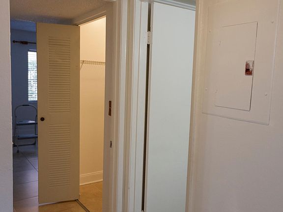 Hallway between bedrooms and half bath
