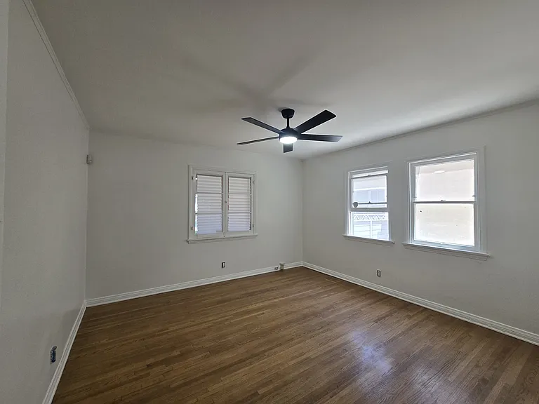 FRONT BEDROOM IS APPROXIMATELY 13' X 12'.9".