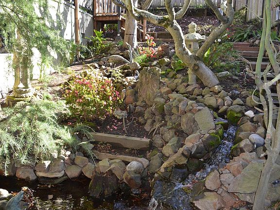 Waterfall at front entrance to house