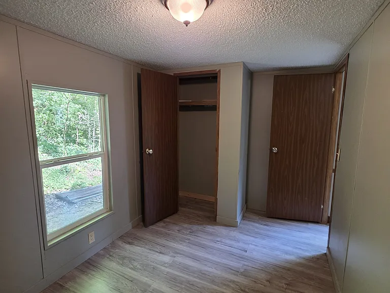 Smaller bedroom and closet.