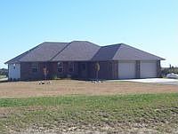 Chip and sealed driveway.  Oversized 2 car garage.