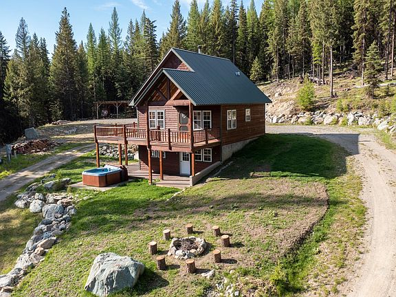 Early spring 2022, lawn filling in around the firepit area