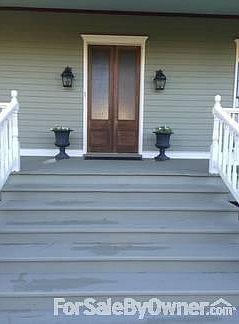 Front Entry
						:
						Antique 8' cypress doors welcome you into the foyer.