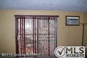 Living room with slider to deck