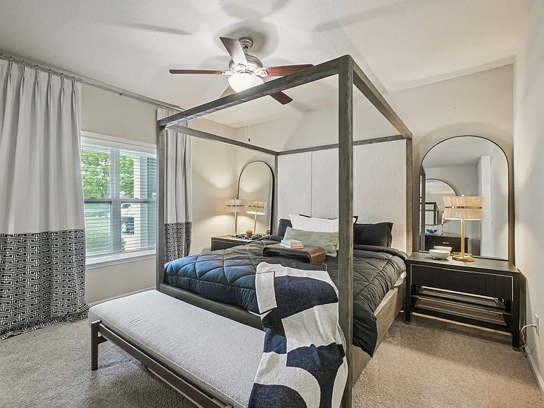 Spacious primary bedroom with contemporary finishes at Village at Broadstone Station in Apex, North Carolina