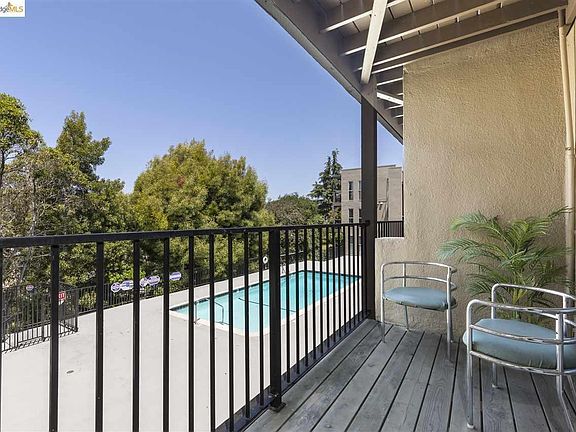 Balcony with view of pool
