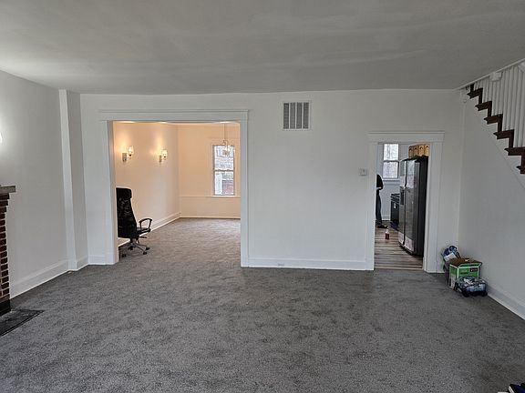 Living room, looking into dining room and kitchen.