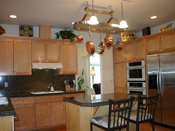 An abundance of custom maple cabinets keeps you so well organized. There is even a small desk conven