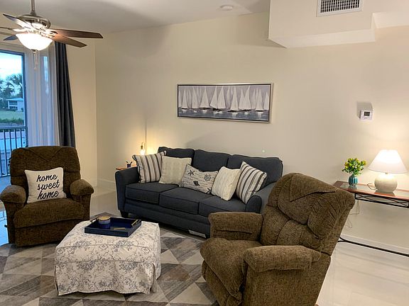 Living room area includes two recliners, ottoman, and a sofa sleeper allowing a total of 6 guests to sleep in the condo.