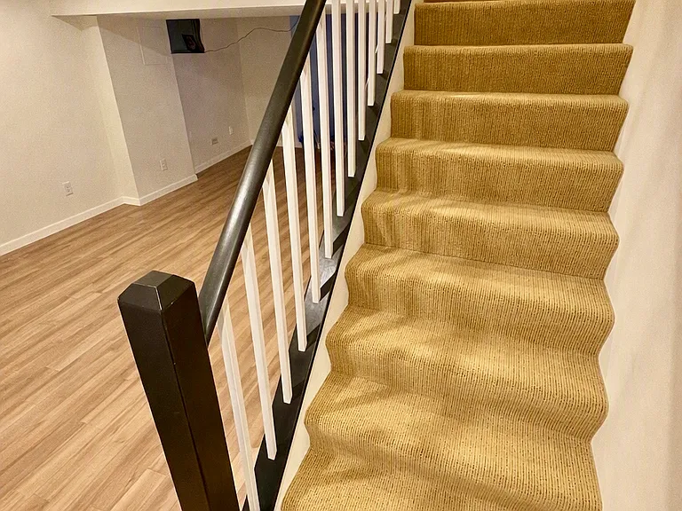 Stairs downstairs to living space. Bedroom 1 at top