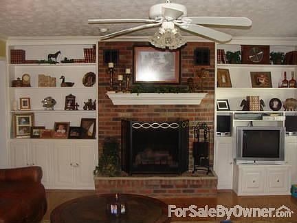 Newly remodeled kitchen
						:
						Kitchen with white cabinets,custom backsplash,a new pantry, and a 3 person bar.