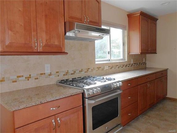 The kitchen is totally remodeled with new cabinets including soft close drawers and quartz counters. Plenty of work space too.