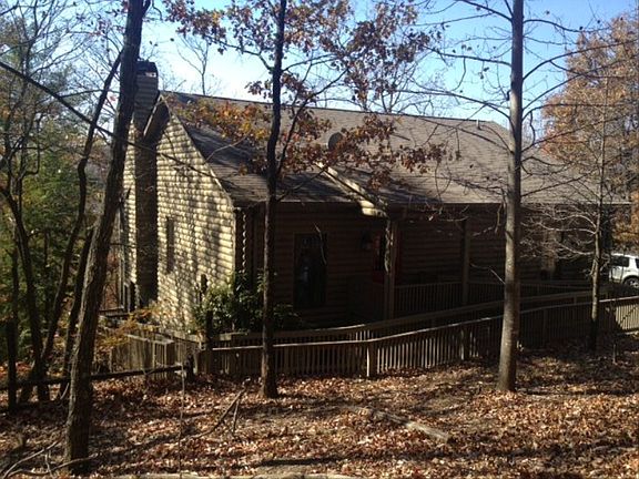 Big Canoe Community. 24 hour man Security Gate. Wooded private lot. Furnished home with seperate living quarters in basement. 