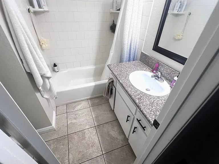 Second bath with grante counter top. toilet is on the left out of view.