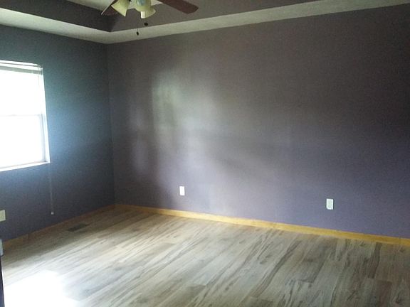 Bright living room with ceiling fan