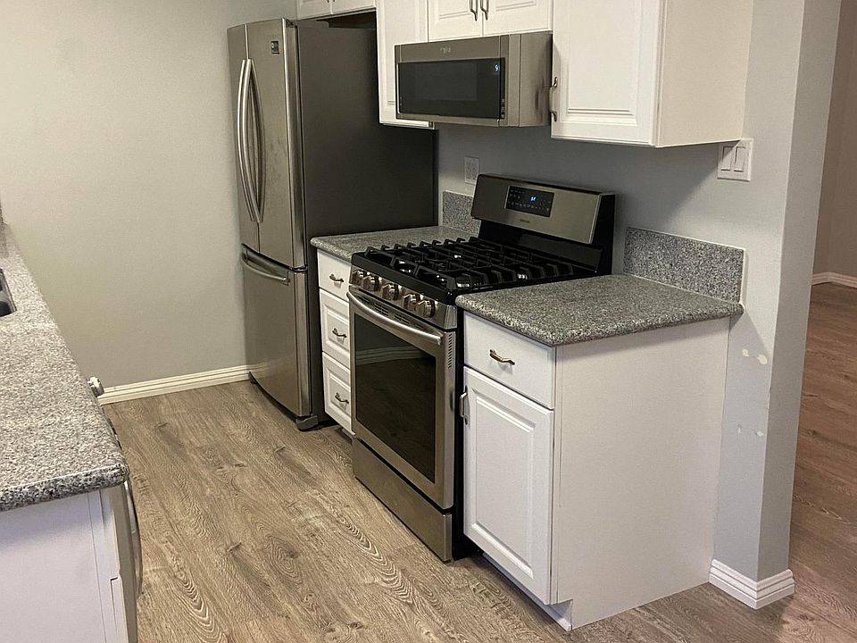 Kitchen - includes refrigerator, stove and built in microwave, Washer/dryer combo and dishwasher.