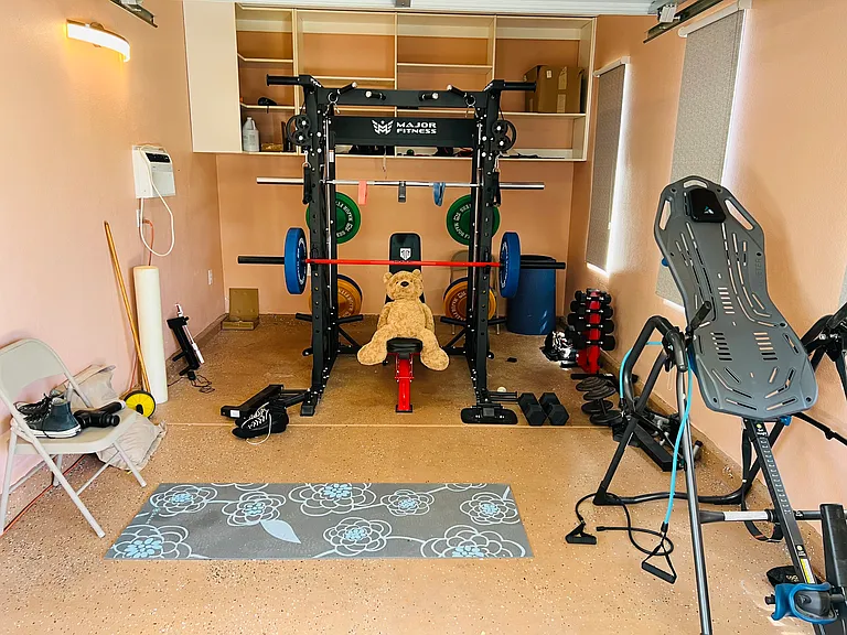 Home Gym (3rd car garage set up). Wall Air Conditioner and ceiling fan with remote control.....all GYM equipment included
