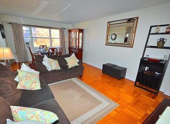 The bright and sunny living room overlooks tree lined Garth Road and has parquet floors.  The room also opens to the large entry foyer.  The living room is 22'-0"x13'-0".