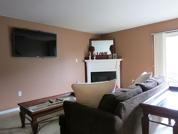 Corner gas fireplace in living room.