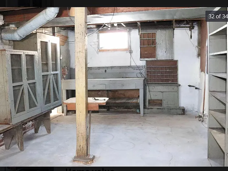 Workshop in basement. Additional room for storage not pictured.