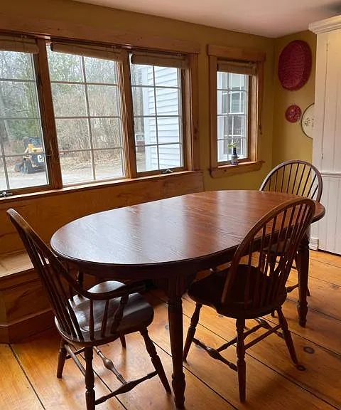 Eating area in kitchen, the table has many leaves to extend the table