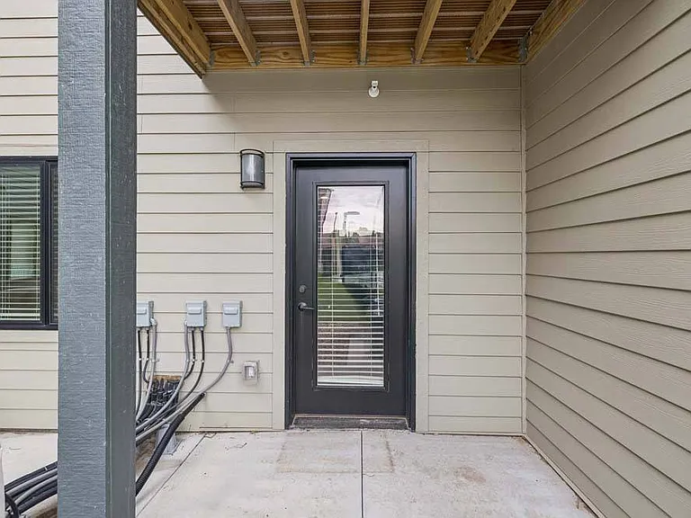 A private covered patio offers a quiet outdoor retreat for relaxing moments close to home.