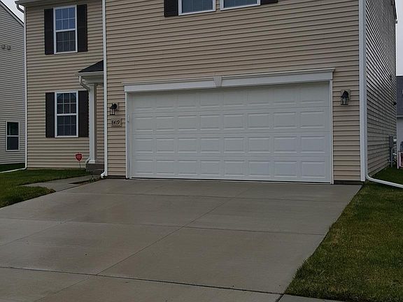 House front with wide driveway