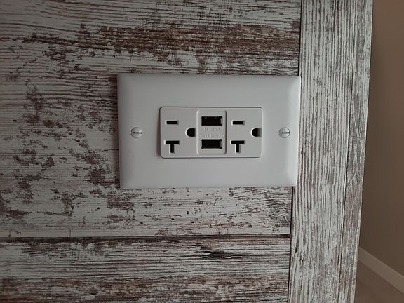 The kitchen island contains three USB outlets for easy cell phone charging capability.