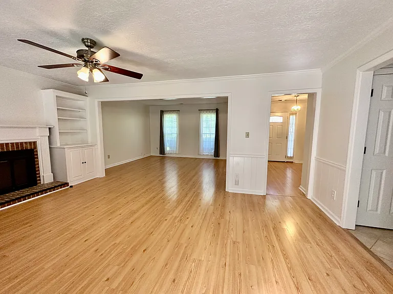 View from the Sunroom Door into the awesome open concept living room, den, and into the foyer.
