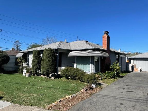 Home on quiet downtown cul-de-sac. Home being prepared for exterior painting.
