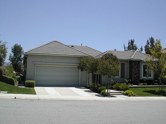 Single story,former model, 3 car tandem garage