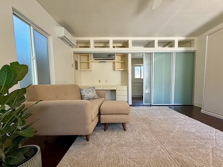 View looking toward built in office
with glass sliding wall.