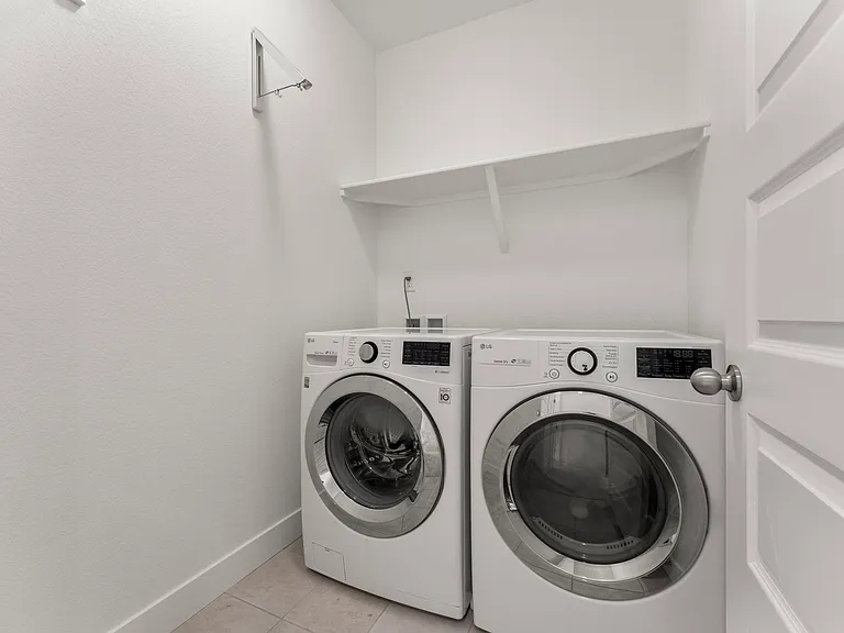 Laundry room located upstairs