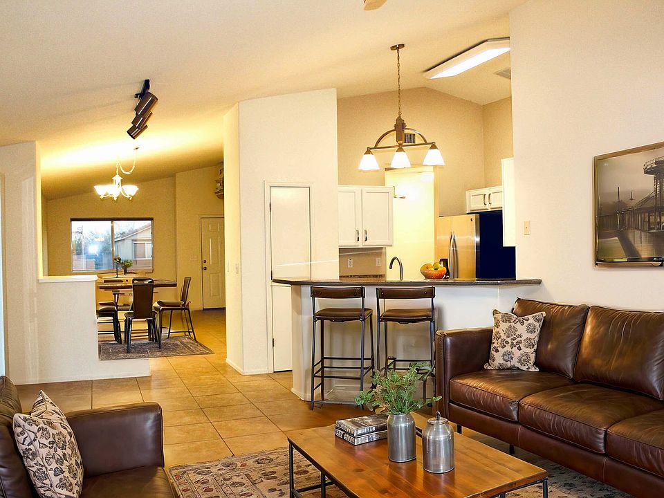 Family room kitchen with breakfast bar opens up to living/dining room Open flex space with high ceilings