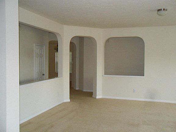 Next through the arches you enter into the dining area. The open hallway walls gives the dining room