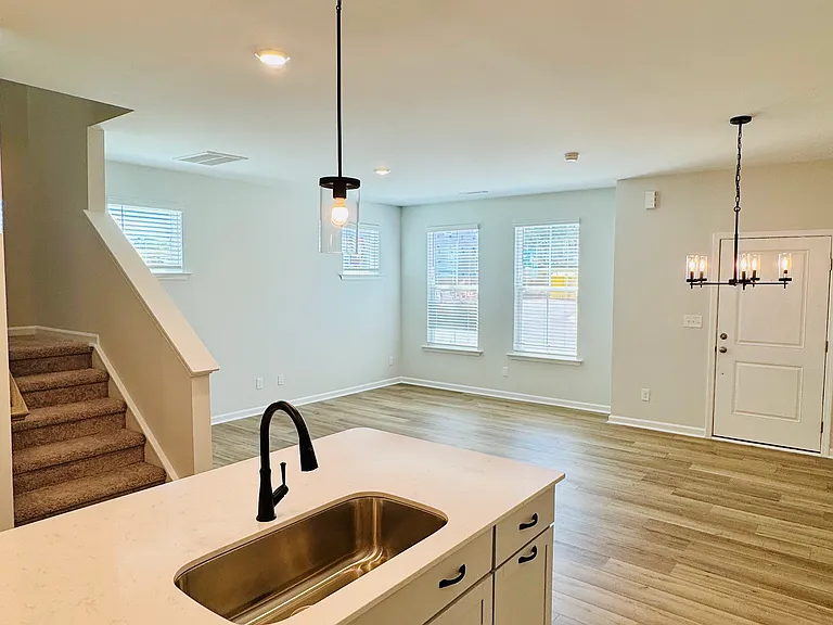 Living/ Dining and open Kitchen View with stairs to bedrooms