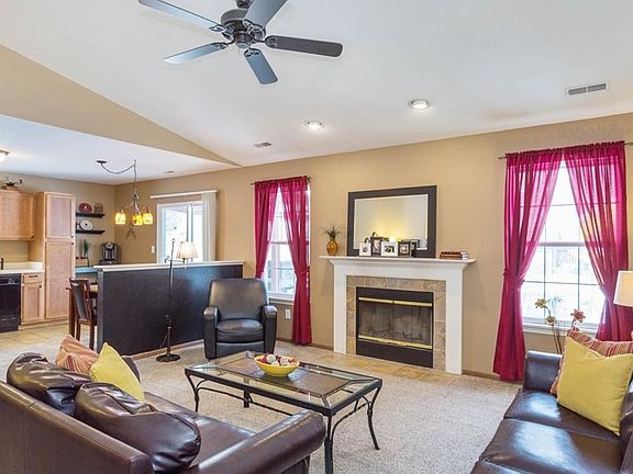 Great Room offers a wood burning fireplace. Open floor plan allows ease of entertaining.