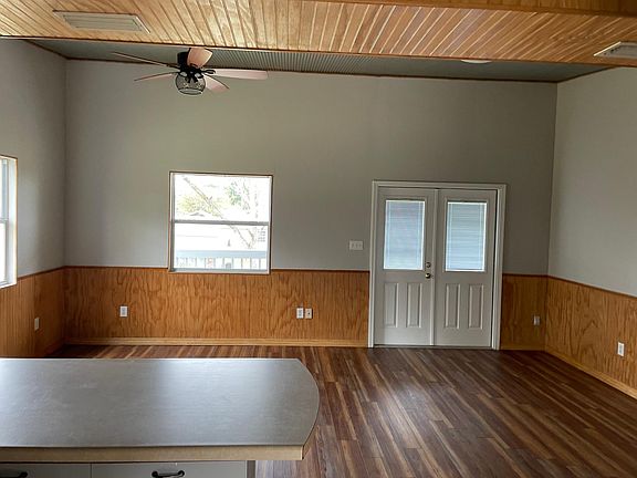 Nice living room with double French doors that open to front balcony