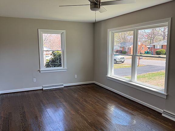 Sunny living room with new large picture windows.