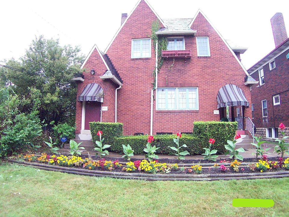Front of 328 1st floor. Flowers are now perennials and awnings are gone. But it still looks great!!
