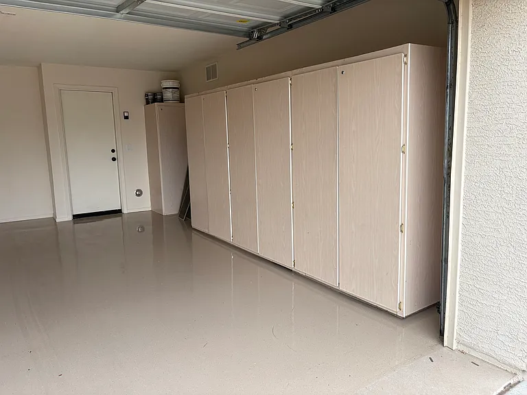 2 Car Garage with Storage Cabinets and EV Charger Hook-up