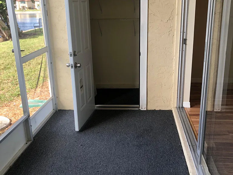 SCREENED LANAI WITH SERVICE DOOR TO LAKE. PLUS STORAGE