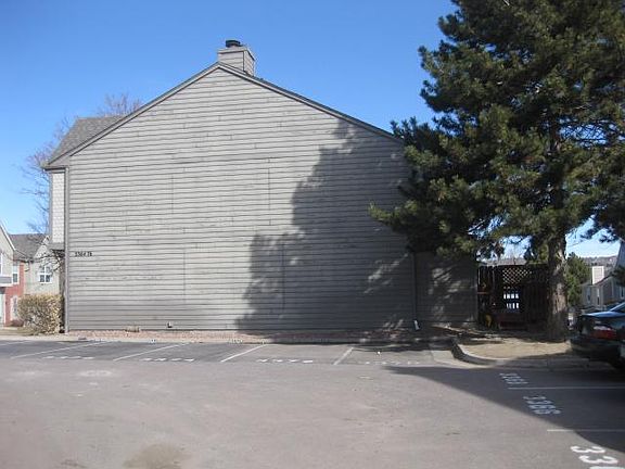 side of building and designated parking spot