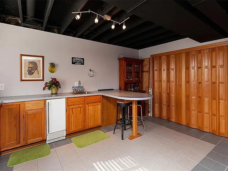 Basement space is perfect for office or rec room. Not shown - next to the kitchenette there is a large space with built-in shelves for storage.