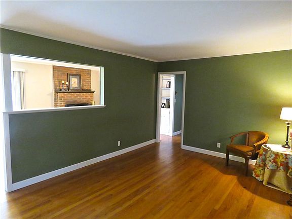 Living room from front door.  Pass-thru to 2nd living area and dining room.