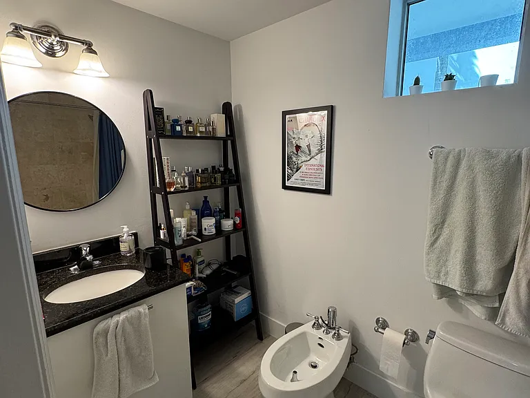 Bathroom - Well appointed bathroom featuring ample storage, and a built-in bidet - combining comfort with European-style touches.