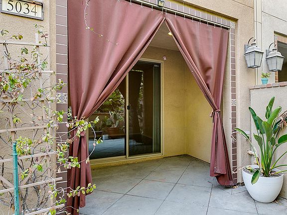 Sliding doors and covered patio from den