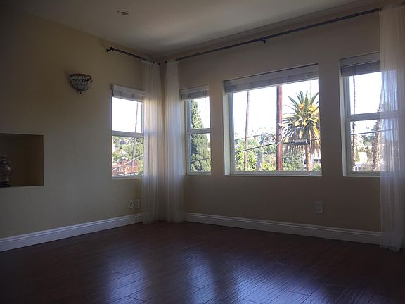 Large front bedroom with attached bonus room/ office and balcony.