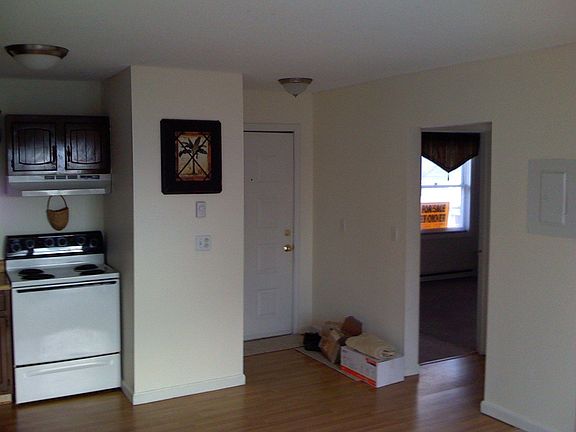 Kitchen and entrance, with coat closet